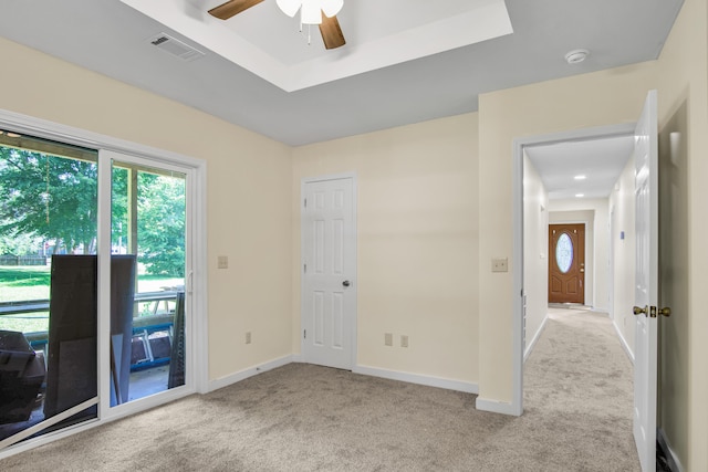 707 N College Ave, Republic, MO 65738 - carpeted empty room with plenty of natural light, a ceiling fan, a smoke detector, and a raised ceiling