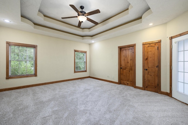 1225 W Wildcherry St, Ozark, MO 65721 - carpeted empty room featuring a ceiling fan, a raised ceiling, and recessed lighting