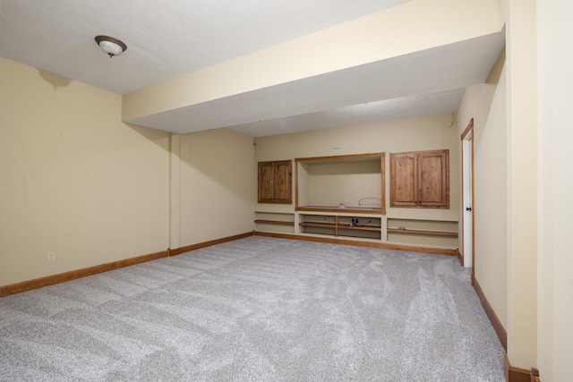 1225 W Wildcherry St, Ozark, MO 65721 - finished basement featuring light colored carpet and baseboards