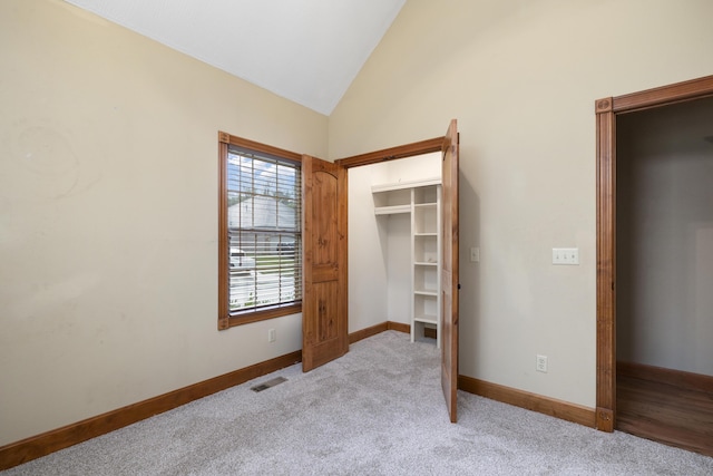 1225 W Wildcherry St, Ozark, MO 65721 - unfurnished bedroom with lofted ceiling and light carpet