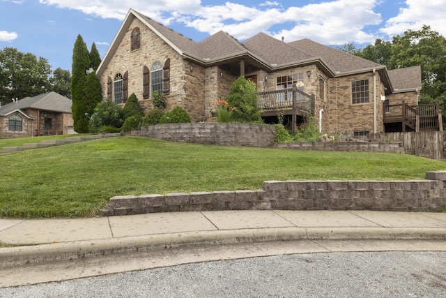 1225 W Wildcherry St, Ozark, MO 65721 - view of front facade with a front yard, brick siding, a shingled roof, and a deck