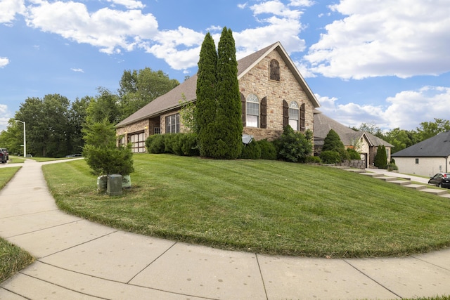 1225 W Wildcherry St, Ozark, MO 65721 - view of home's exterior featuring stone siding, a yard, and brick siding