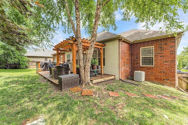 811 Gold Rush Ave, Nixa, MO 65714 - back of house with a pergola, a deck, a fenced backyard, brick siding, and a shingled roof