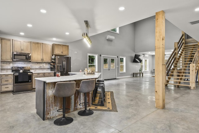 3918 Bowen Creek Rd, Niangua, MO 65713 - kitchen with stainless steel appliances, concrete flooring, recessed lighting, light countertops, and decorative backsplash