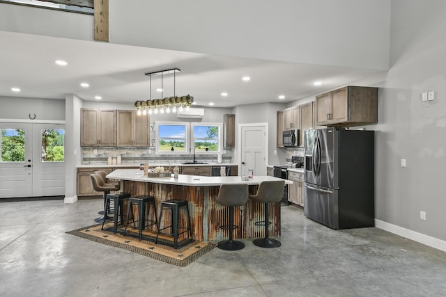 3918 Bowen Creek Rd, Niangua, MO 65713 - kitchen featuring appliances with stainless steel finishes, concrete flooring, backsplash, recessed lighting, and a center island