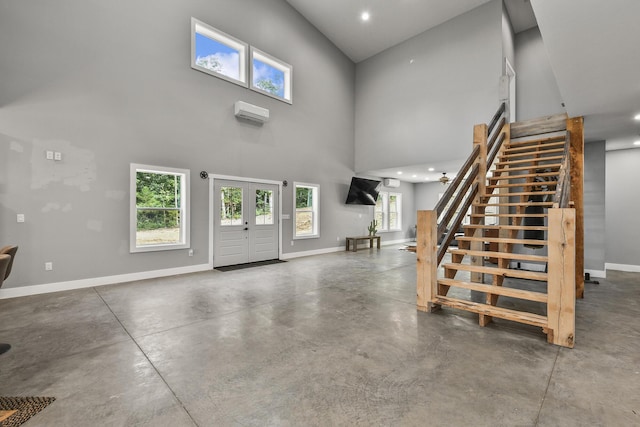 3918 Bowen Creek Rd, Niangua, MO 65713 - foyer entrance featuring stairs, finished concrete flooring, a towering ceiling, recessed lighting, and an AC wall unit