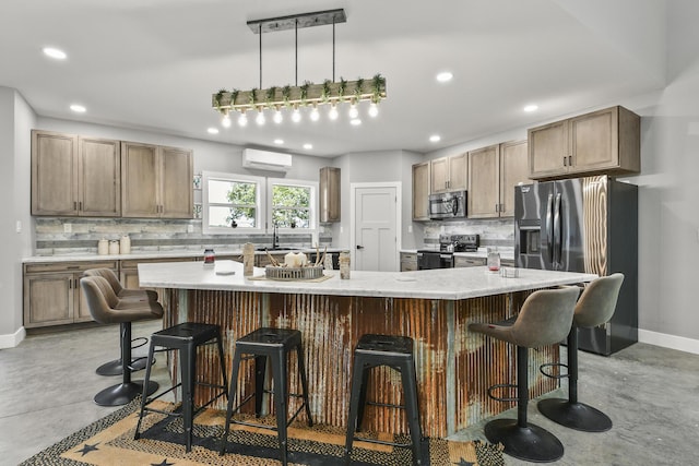 3918 Bowen Creek Rd, Niangua, MO 65713 - kitchen featuring appliances with stainless steel finishes, finished concrete floors, tasteful backsplash, recessed lighting, and a breakfast bar