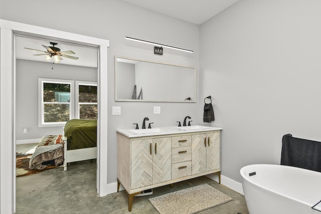 3918 Bowen Creek Rd, Niangua, MO 65713 - full bath with unfinished concrete floors, double vanity, a freestanding tub, ceiling fan, and connected bathroom