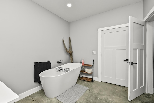 3918 Bowen Creek Rd, Niangua, MO 65713 - full bathroom featuring a freestanding bath and concrete flooring