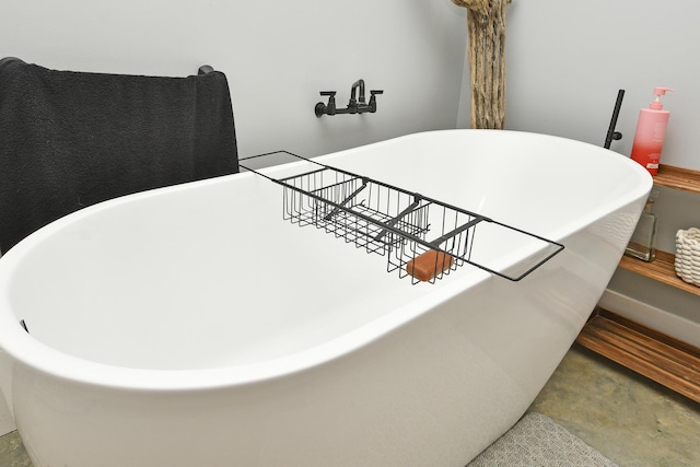 3918 Bowen Creek Rd, Niangua, MO 65713 - bathroom view of concrete floors and a freestanding bath