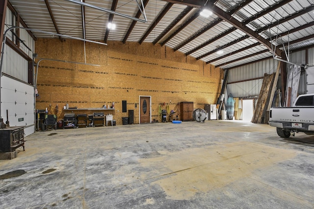 3918 Bowen Creek Rd, Niangua, MO 65713 - garage featuring metal wall and a workshop area