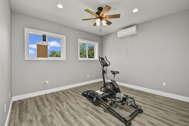 3918 Bowen Creek Rd, Niangua, MO 65713 - exercise area with an AC wall unit, wood finished floors, ceiling fan, and recessed lighting