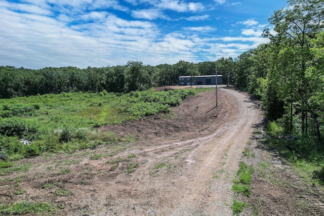 3918 Bowen Creek Rd, Niangua, MO 65713 - view of dirt / gravel road with a forest view