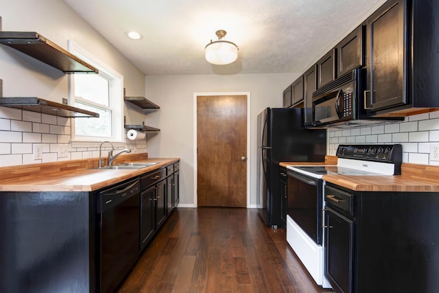 4252 W Madison St, Springfield, MO 65802 - kitchen with open shelves, wood counters, black appliances, dark wood-style floors, and decorative backsplash
