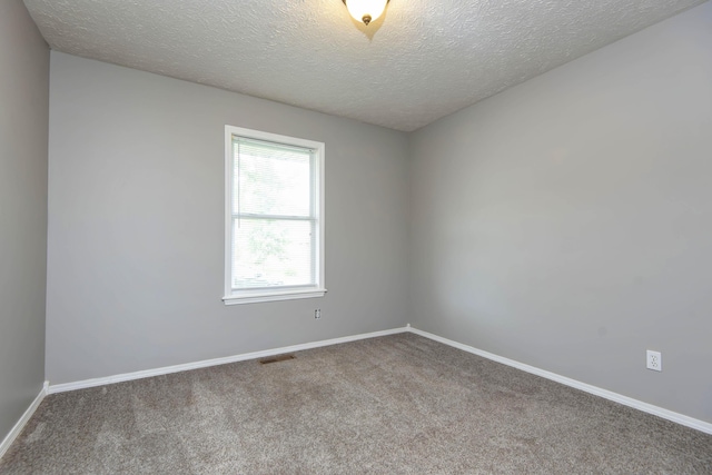 4252 W Madison St, Springfield, MO 65802 - unfurnished room featuring carpet and a textured ceiling