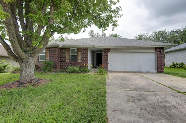 4252 W Madison St, Springfield, MO 65802 - ranch-style house with a garage, brick siding, concrete driveway, a front lawn, and roof with shingles