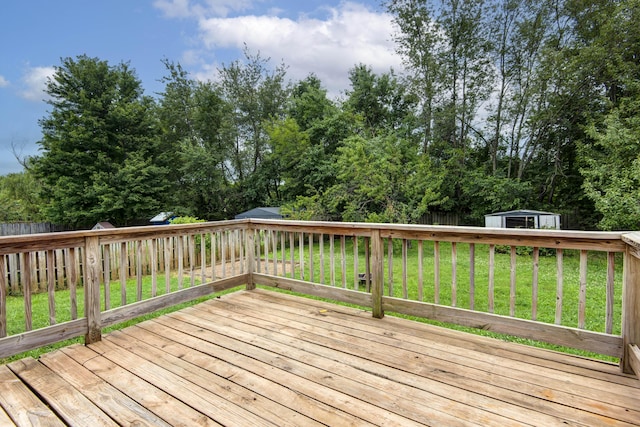 4252 W Madison St, Springfield, MO 65802 - wooden deck with a storage shed and a fenced backyard