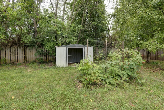4252 W Madison St, Springfield, MO 65802 - fenced backyard featuring a storage unit