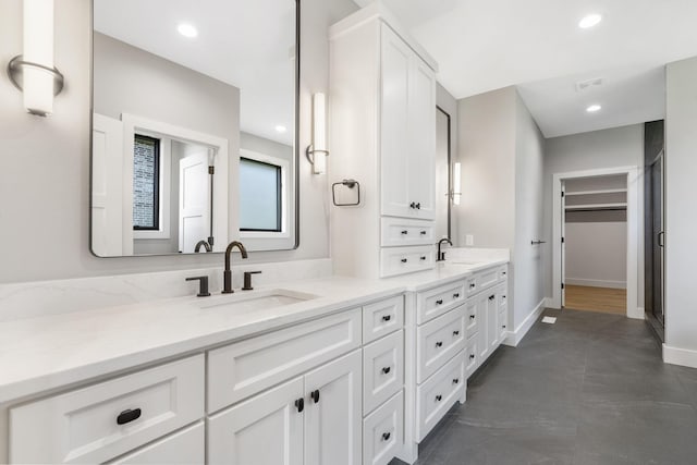 1632 Marlowe Ave, Springfield, MO 65802 - full bathroom featuring double vanity, a spacious closet, and recessed lighting