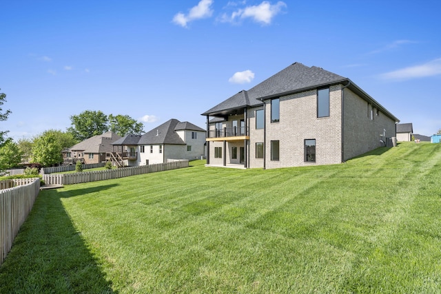 1632 Marlowe Ave, Springfield, MO 65802 - rear view of property with a balcony, brick siding, a fenced backyard, and roof with shingles