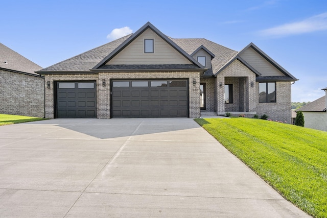1632 Marlowe Ave, Springfield, MO 65802 - view of front of home featuring brick siding, a garage, driveway, a front yard, and a shingled roof