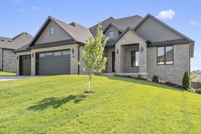 1632 Marlowe Ave, Springfield, MO 65802 - view of front facade featuring brick siding, an attached garage, a front lawn, and a shingled roof