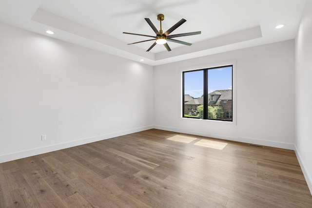 1650 Marlowe Ave, Springfield, MO 65802 - unfurnished room with a raised ceiling, wood finished floors, ceiling fan, and recessed lighting