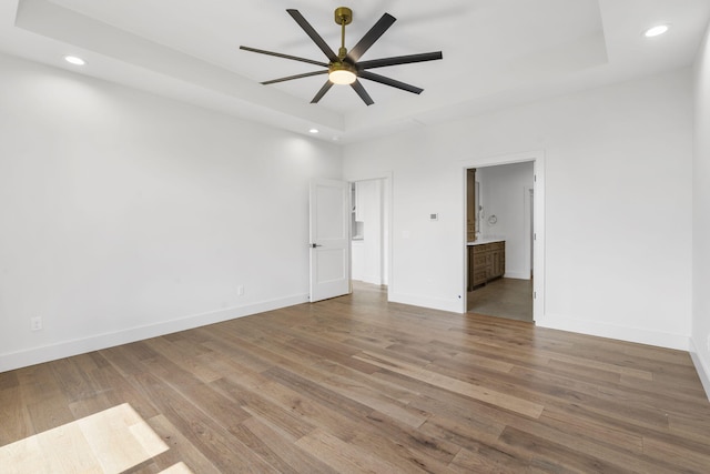 1650 Marlowe Ave, Springfield, MO 65802 - spare room featuring a raised ceiling, a ceiling fan, wood finished floors, and recessed lighting