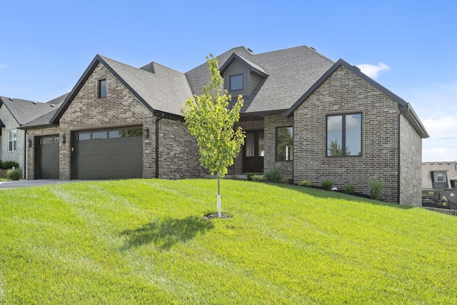 1650 Marlowe Ave, Springfield, MO 65802 - view of front of property featuring brick siding, an attached garage, a front yard, and roof with shingles