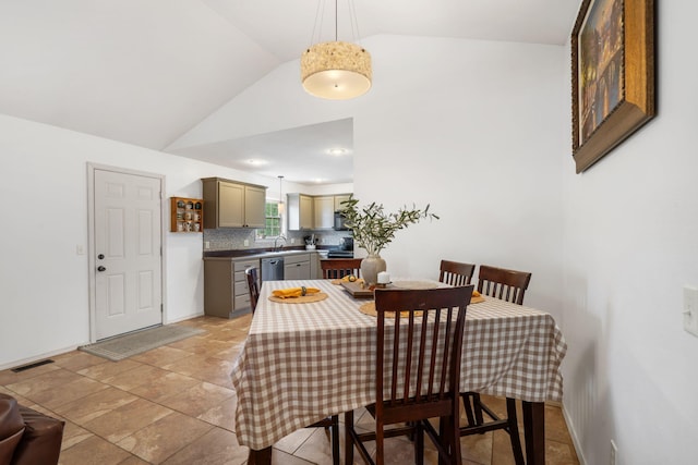 1300 W Robin St, Ozark, MO 65721 - dining area featuring lofted ceiling and baseboards
