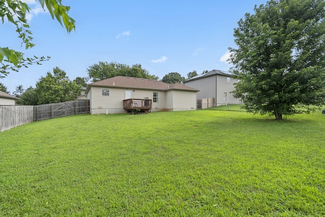 1300 W Robin St, Ozark, MO 65721 - fenced backyard with a wooden deck