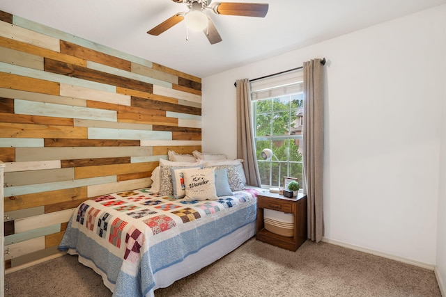 1300 W Robin St, Ozark, MO 65721 - carpeted bedroom with wood walls and a ceiling fan