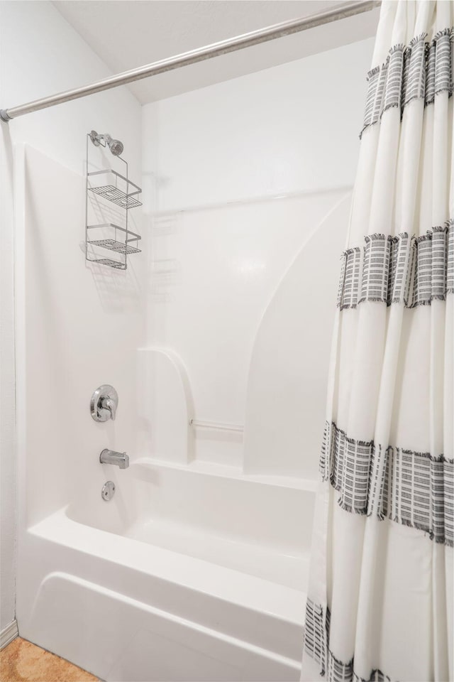 1300 W Robin St, Ozark, MO 65721 - bathroom featuring shower / bath combo and tile patterned flooring