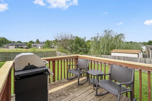 1300 W Robin St, Ozark, MO 65721 - wooden terrace featuring grilling area and a fenced backyard