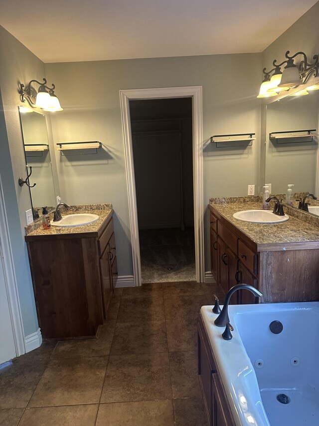 5605 N Seacrest Dr, Ozark, MO 65721 - full bathroom with two vanities, a jetted tub, and tile patterned floors