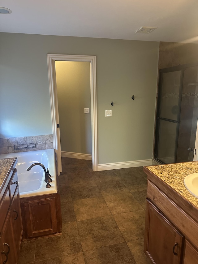 5605 N Seacrest Dr, Ozark, MO 65721 - bathroom featuring vanity and a garden tub