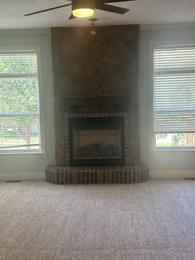 5605 N Seacrest Dr, Ozark, MO 65721 - unfurnished living room with a ceiling fan, a fireplace, carpet flooring, ornamental molding, and healthy amount of natural light