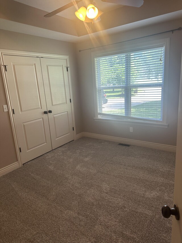 5605 N Seacrest Dr, Ozark, MO 65721 - unfurnished bedroom with carpet flooring, a closet, and a ceiling fan