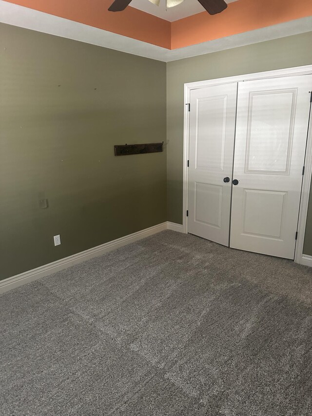 5605 N Seacrest Dr, Ozark, MO 65721 - unfurnished bedroom with carpet flooring, a closet, and a ceiling fan
