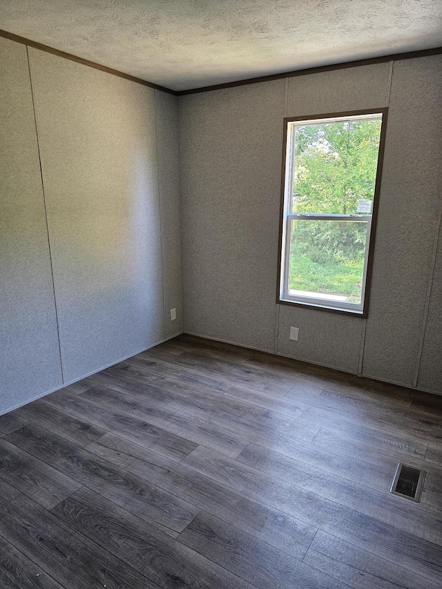 000 Oak St, Conway, MO 65632 - spare room featuring wood finished floors and a textured ceiling