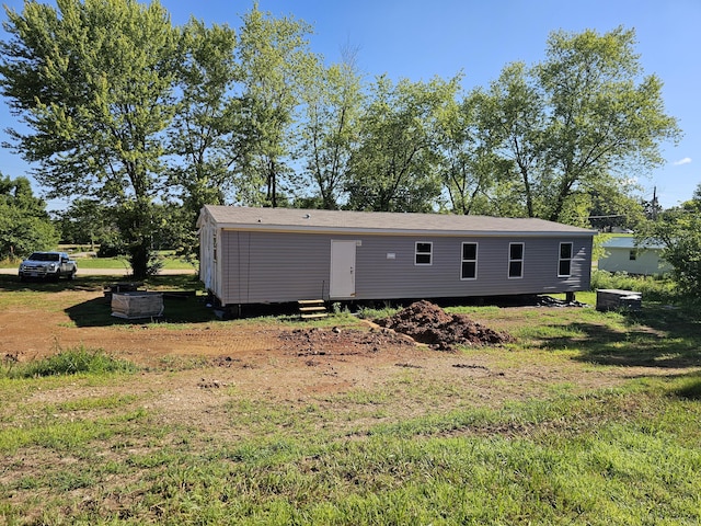 000 Oak St, Conway, MO 65632 - back of house with entry steps and a yard