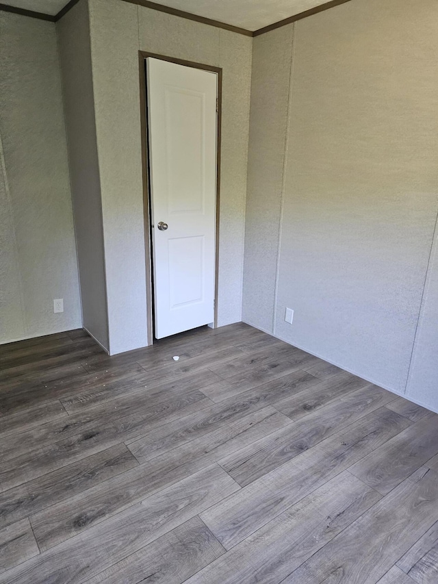 000 Oak St, Conway, MO 65632 - unfurnished room with crown molding and wood finished floors