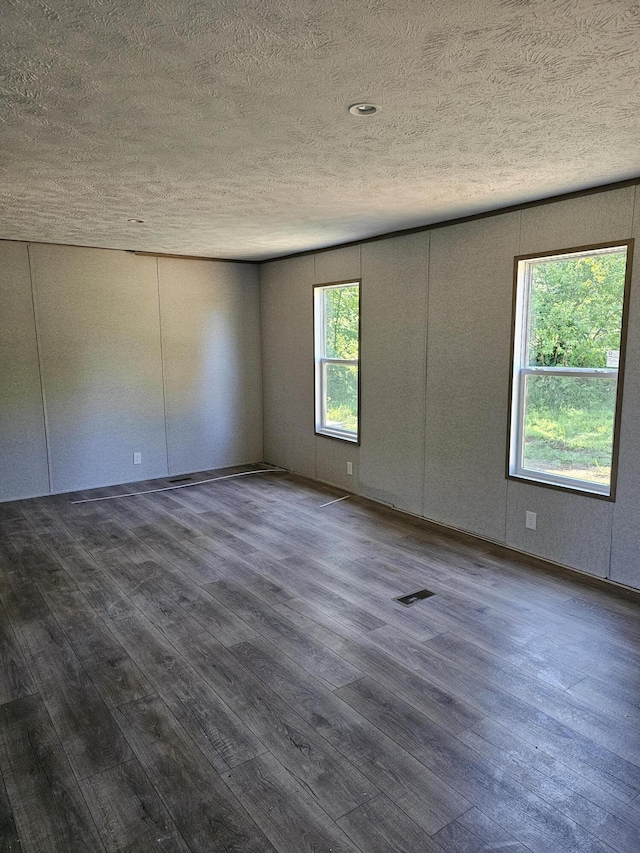 000 Oak St, Conway, MO 65632 - unfurnished room with a textured ceiling and wood finished floors