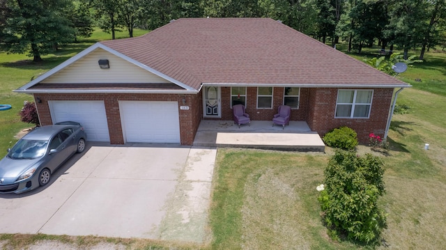 163 Hidden Hollow Dr, Marshfield, MO 65706 - view of front of house with brick siding, a garage, a front lawn, and concrete driveway