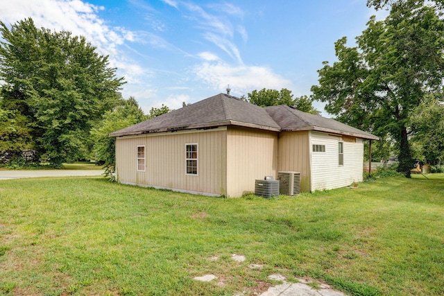 427 Morgan Ave, Aurora, MO 65605 - view of home's exterior with a lawn and a central AC unit