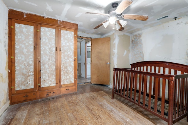 427 Morgan Ave, Aurora, MO 65605 - unfurnished bedroom with wood-type flooring and a ceiling fan
