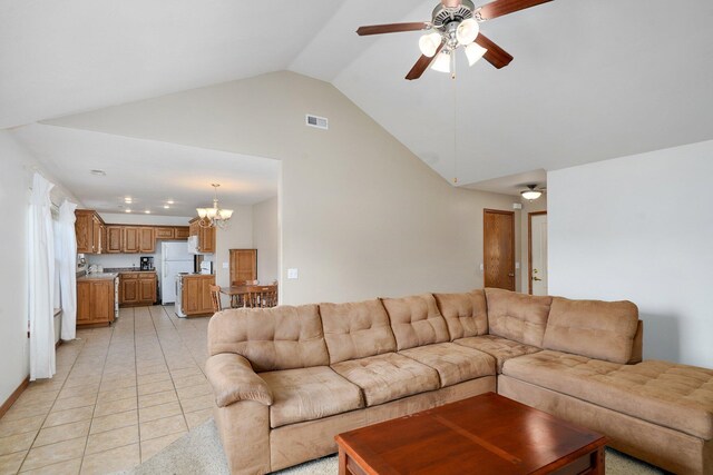 218 Tyler Ct, Mount Vernon, MO 65712 - living area featuring ceiling fan, a chandelier, high vaulted ceiling, and light tile patterned flooring