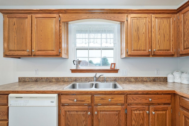 218 Tyler Ct, Mount Vernon, MO 65712 - kitchen featuring white dishwasher and brown cabinets