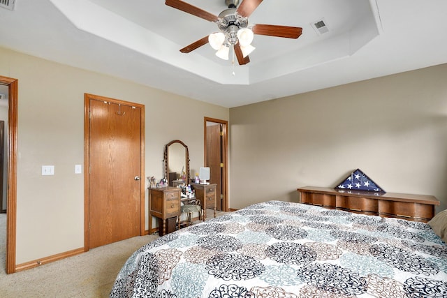 218 Tyler Ct, Mount Vernon, MO 65712 - bedroom with carpet floors, a tray ceiling, a ceiling fan, and a closet