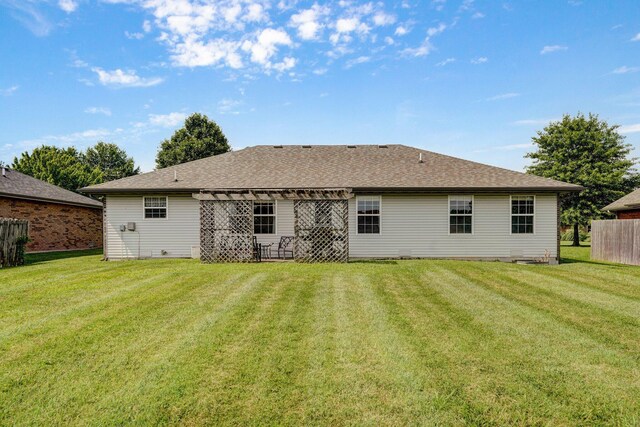 218 Tyler Ct, Mount Vernon, MO 65712 - back of property featuring a pergola and roof with shingles